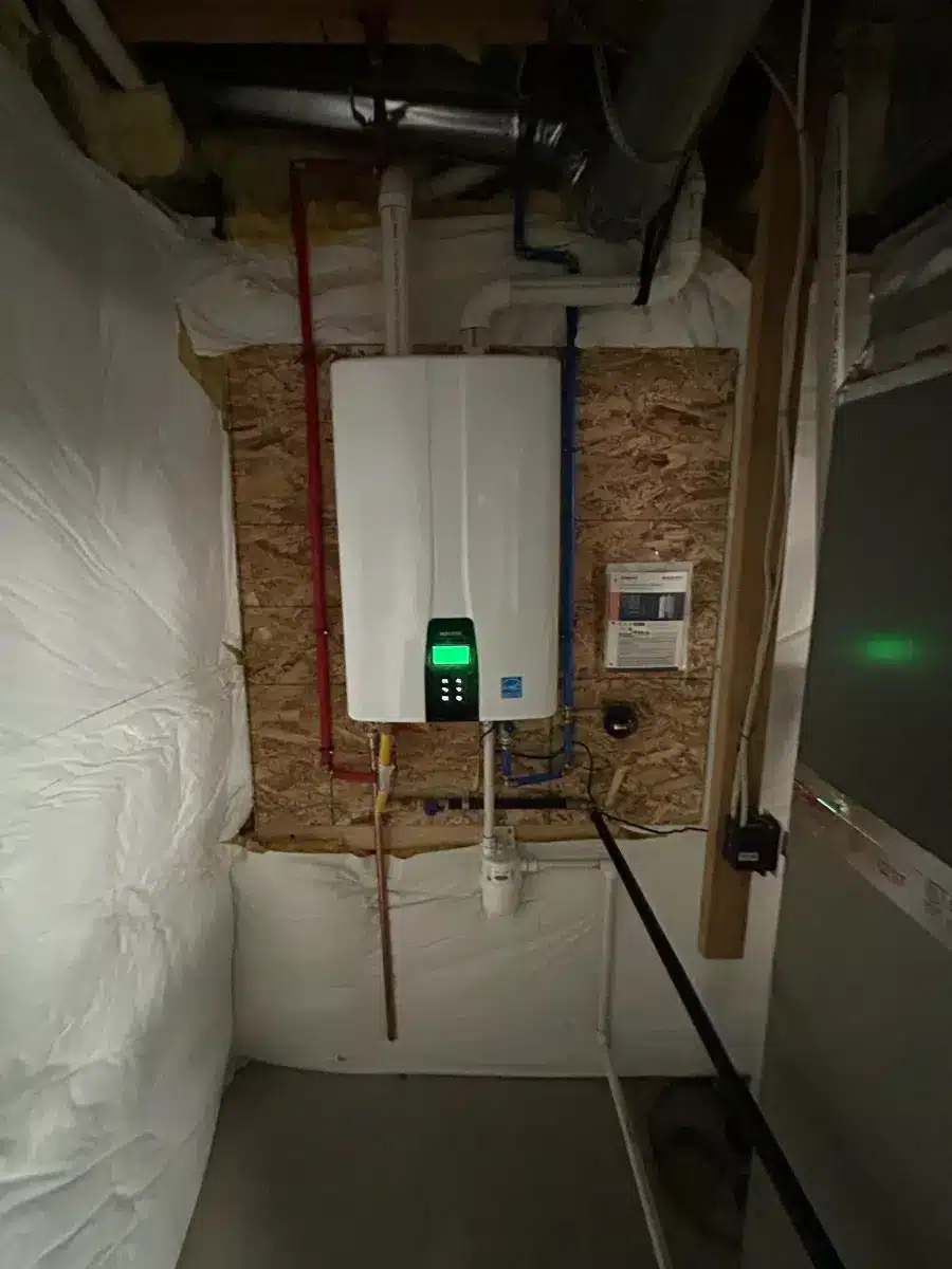 Tank to tankless water heater conversion in a Colorado Springs basement with new gas line