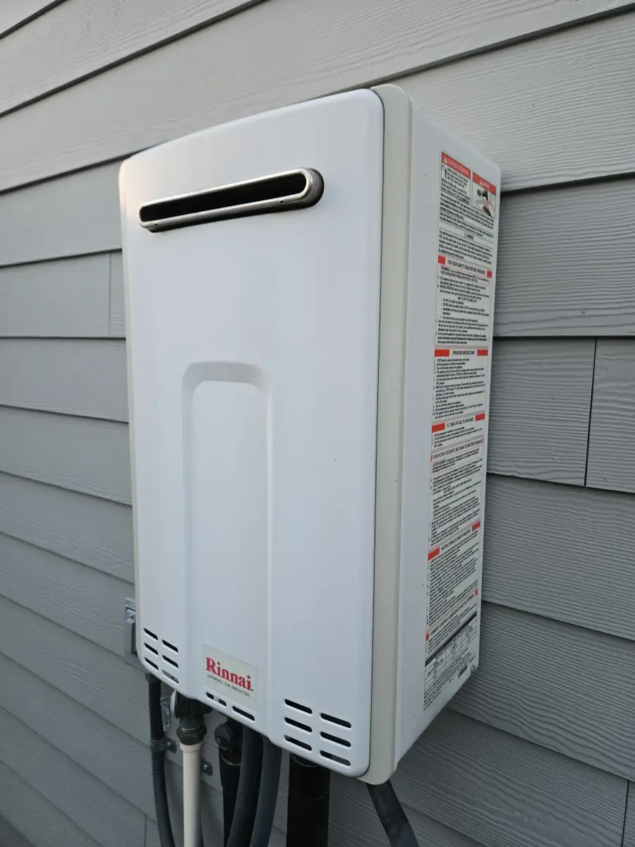 Rinnai tankless water heater replacement in Colorado Springs showing gas and water connections